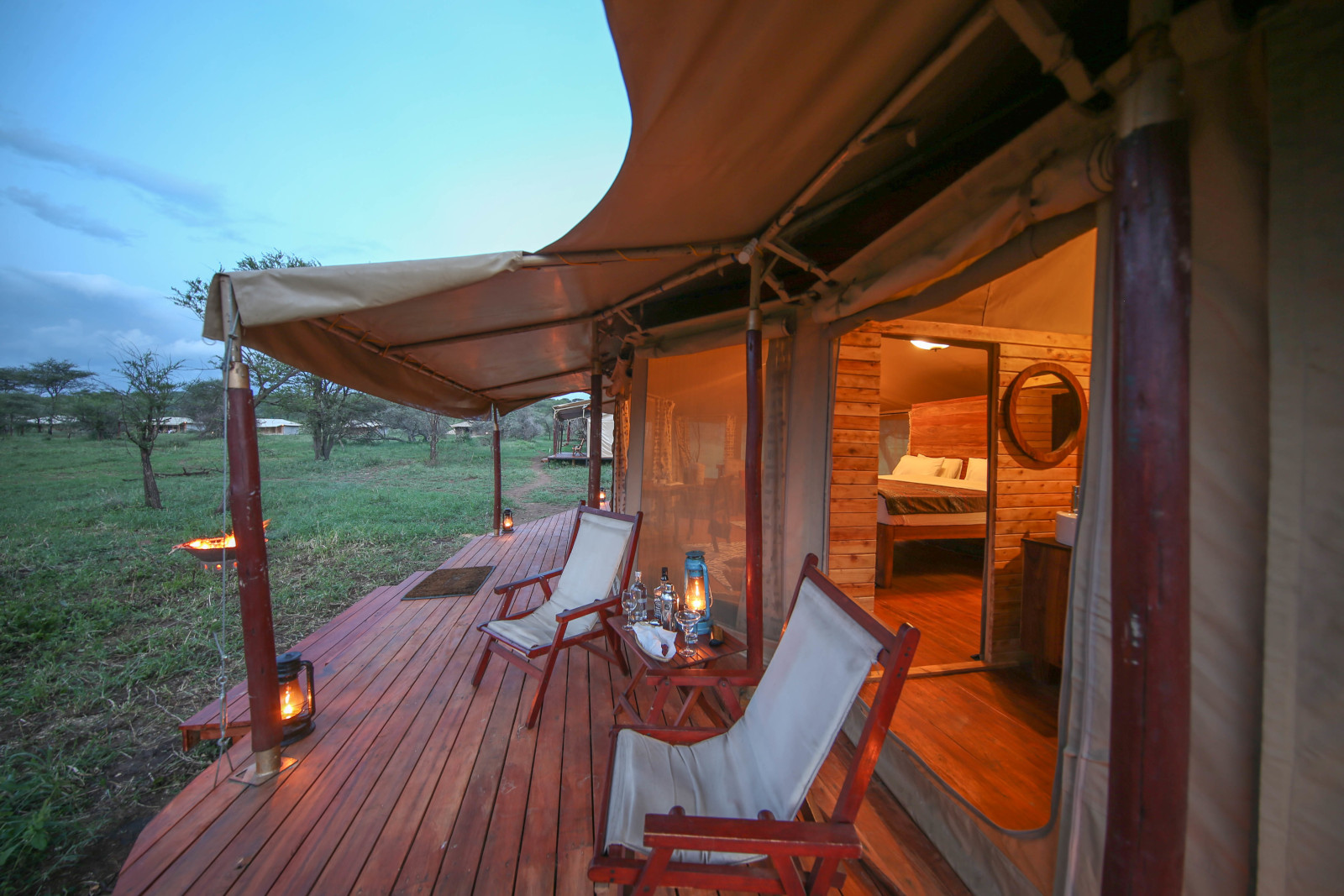 http://leyutours.com/wp-content/uploads/2023/06/Feature-Accommodation-in-Serengeti-National-Park-Tanzania-View-from-Deck-at-Sunset.jpg